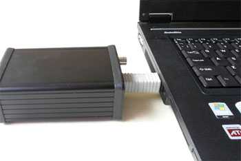 [John Kenny SPDIF Mk 3 USB converter - coupled to laptop computer with rigid adaptor.]