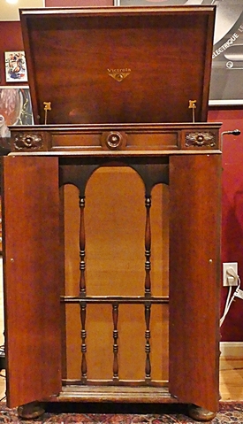 [Credenza, horn and lid open]