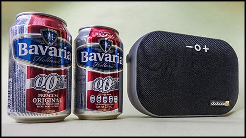 [Dodocool DA150 wireless portable speaker compared to 330ml cans of beer]