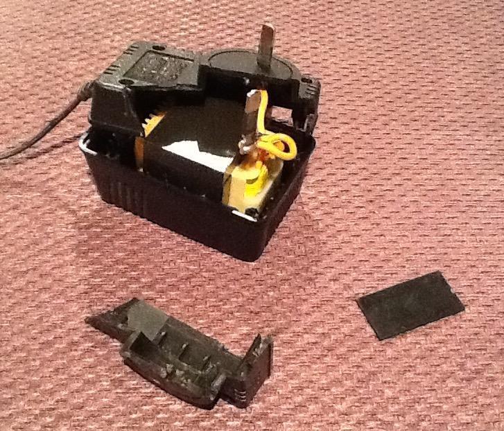 [Damaged AC/DC power adaptor]
